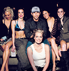 Billy Dec surrounded by models from a recent show